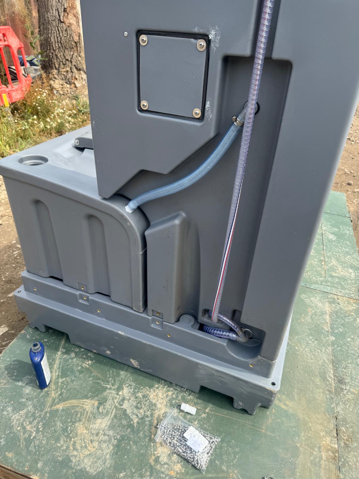 Portable toilet water and waste tank pipework