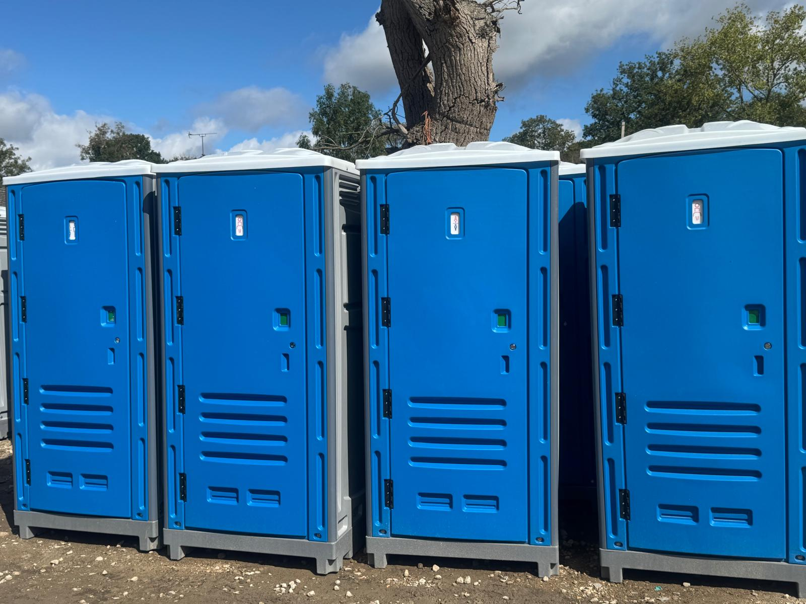 Row of new blue portable toilets for sale